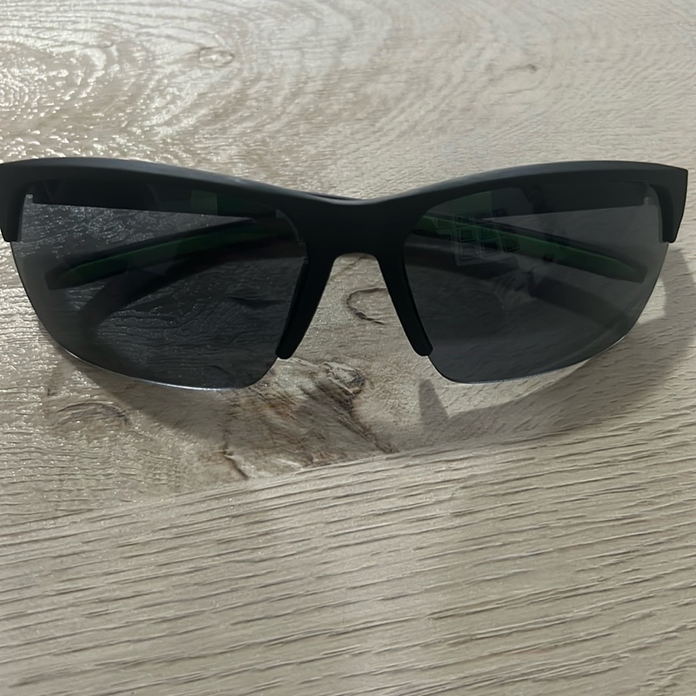 Selling black shades with a touch of green. Never been used.